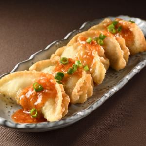 Fried gyoza with chili sauce