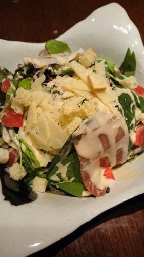 Caesar salad with prosciutto and parmesan cheese