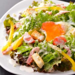 Caesar salad with hot spring egg and bacon