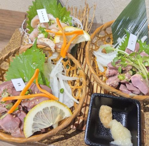Boat-shaped platter of three kinds of chicken sashimi