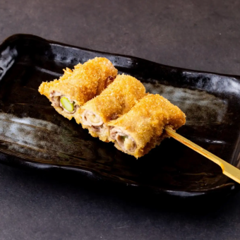 Deep-fried skewers of meat and vegetables