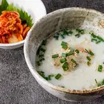 Chicken broth soup with rice and kimchi
