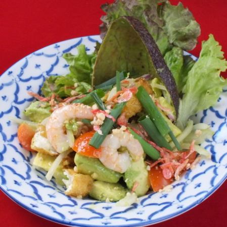 Fried egg salad with shrimp and avocado