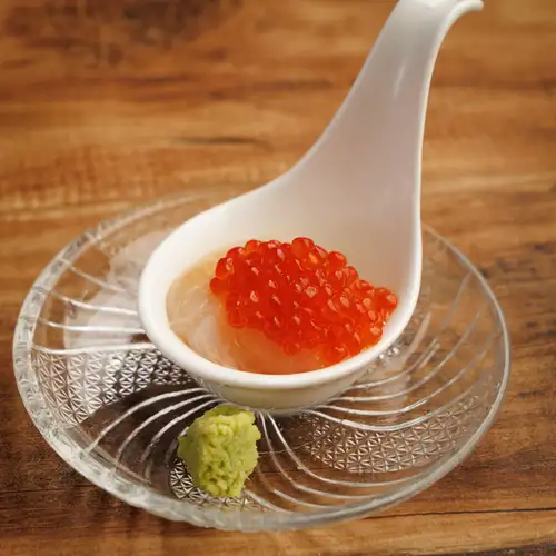 A spoonful of luxurious salmon roe and raw scallops.
