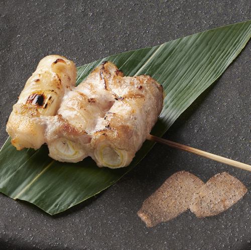 Meat-wrapped leek skewers