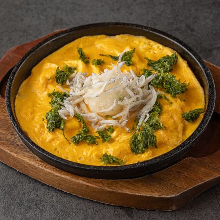 Fried egg with whitebait and seaweed broth