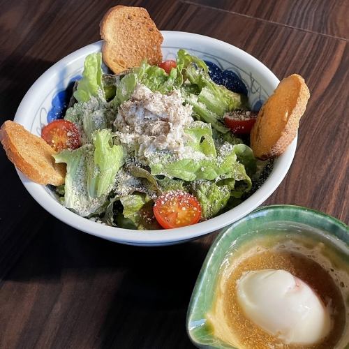 Caesar salad with steamed chicken and hot spring egg