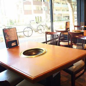 We offer glass-walled table seating with an open feel.