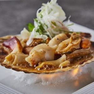 Grilled scallops and whelks with butter and soy sauce