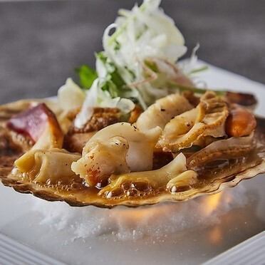 Grilled scallops and whelks with butter and soy sauce