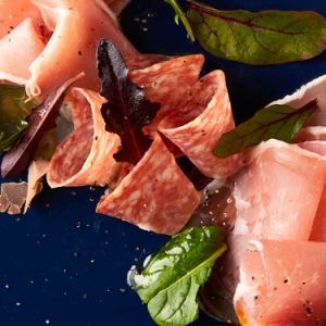 Assortment of raw ham and salami