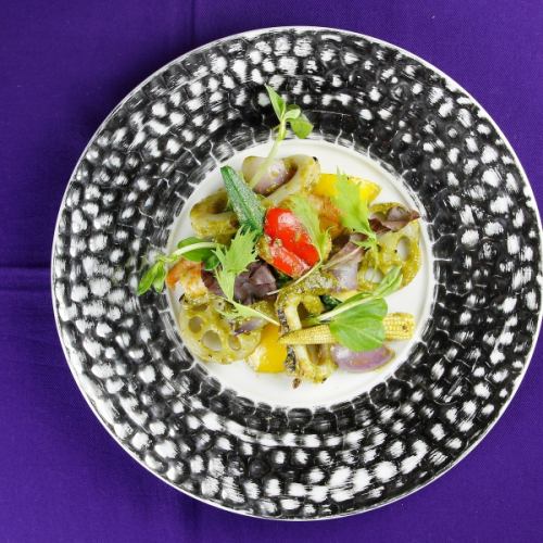 Warm salad with seafood and seasonal vegetables in Genoa sauce