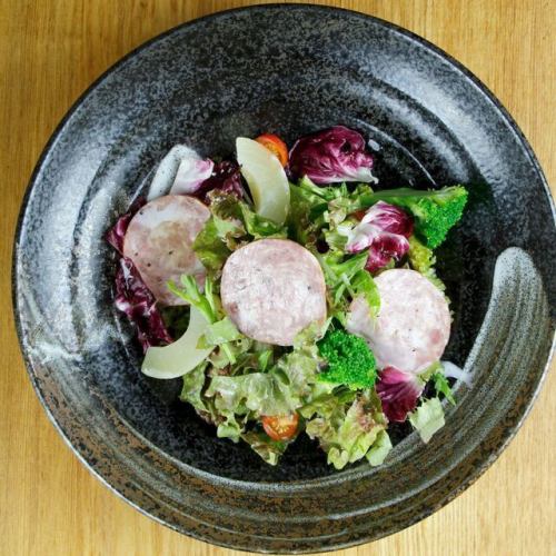 Caesar salad with bologna sausage and fruit