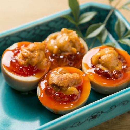 Soft-boiled egg topped with sea urchin roe