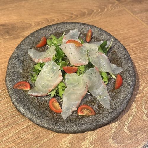 Sea bream carpaccio served with vegetables from Kajitani Farm