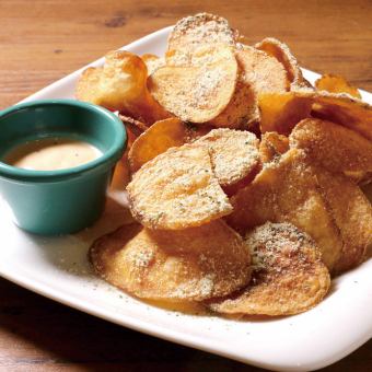 Freshly fried potato chips with Japanese pepper dip