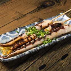 Grilled squid tentacles skewers with butter and soy sauce