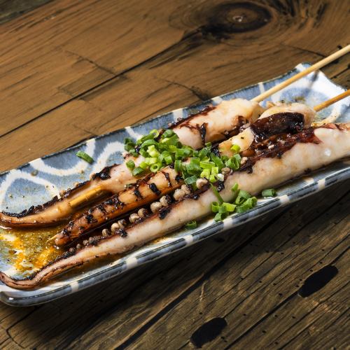 Grilled squid tentacles skewers with butter and soy sauce