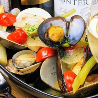 A heaping variety of shellfish steamed in white wine