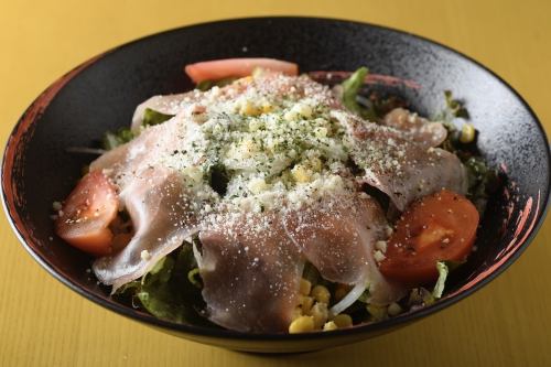 Caesar salad with prosciutto and parmesan cheese