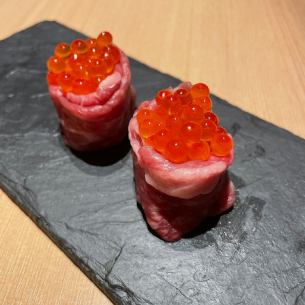 Meat sushi with salmon roe
