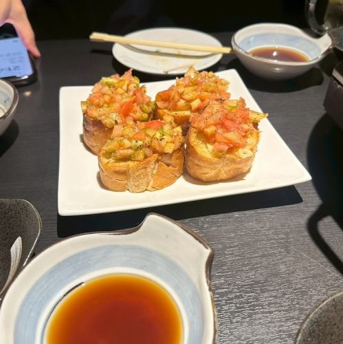 【当店オリジナル料理】ガーリックトーストにトマトが山盛り◆トクスケッタ980円(税込)