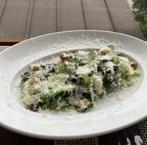 Caesar salad with parmigiano reggiano cheese and three types of lettuce