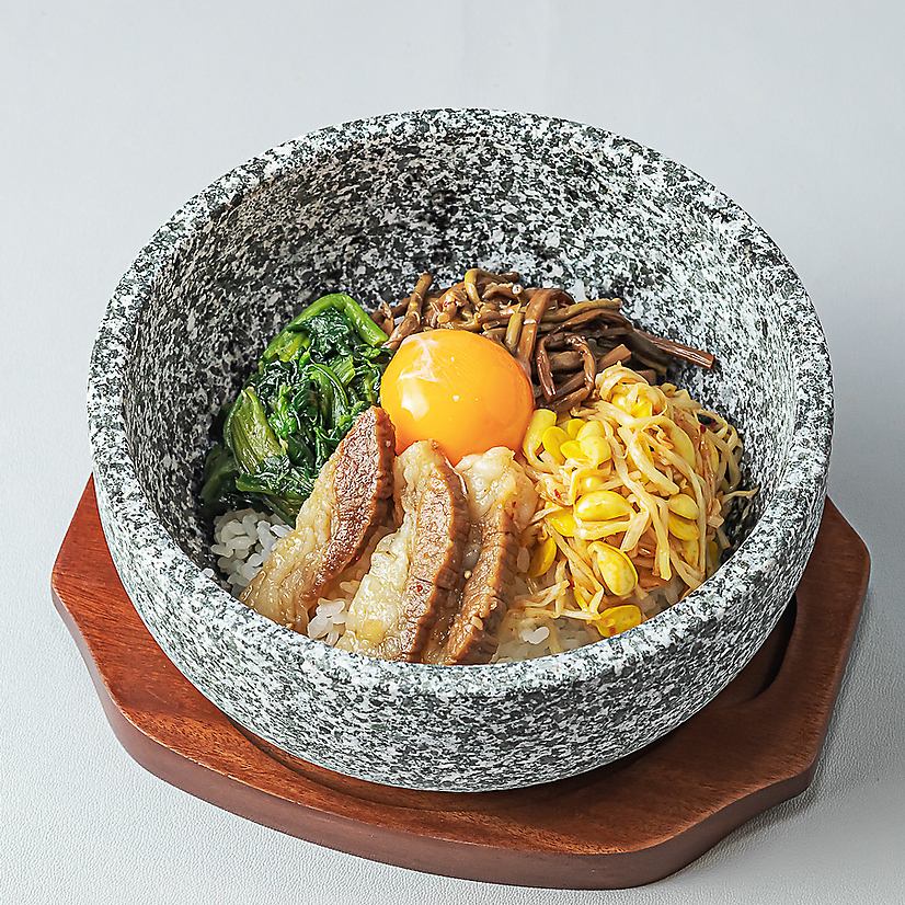 A wide selection of Korean dishes, including crispy, scorched stone-grilled bibimbap