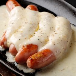 Grilled sausage with raclette cheese