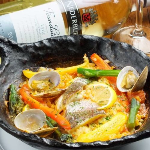 Paella set Paella with sea bream, seafood, and seasonal vegetables