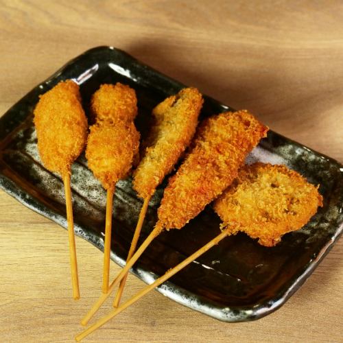 Assorted deep-fried skewers