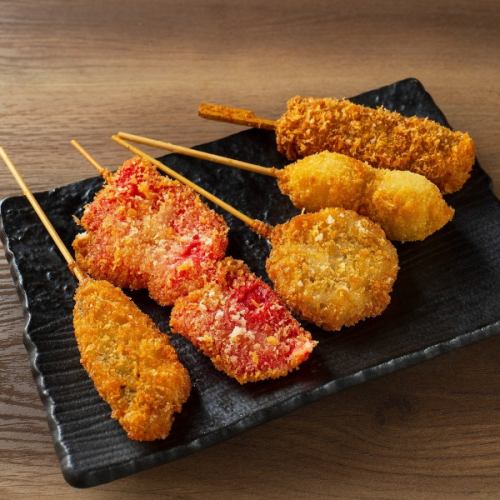 Assorted deep-fried skewers