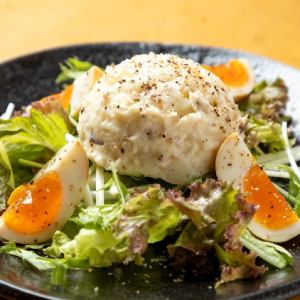 Iburigakko potato salad topped with smoked balls