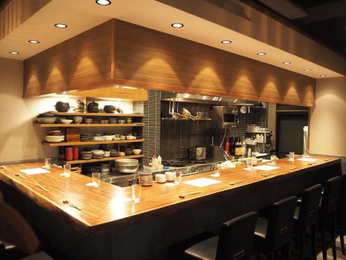 Counter seats surrounding the kitchen