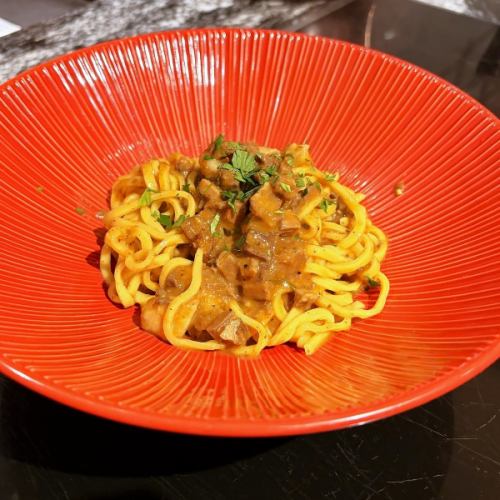 Wild boar ragout and chitarra pasta with mountain vegetables