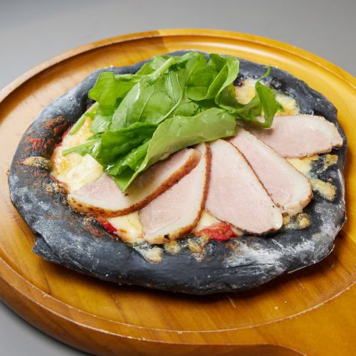 Homemade duck ham and arugula pizza