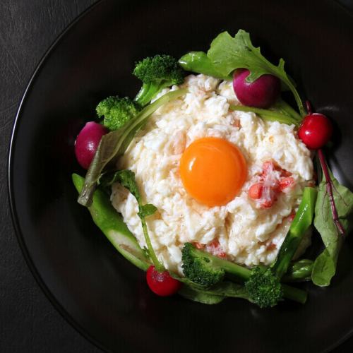 Fried Unzen egg whites with egg yolk sauce and selected vegetables