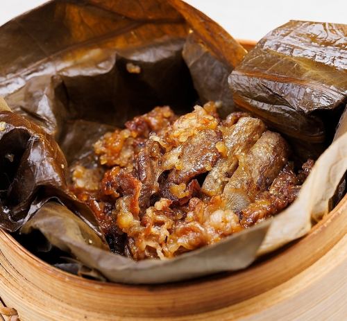 Steamed Omi beef and fresh burdock wrapped in lotus leaves