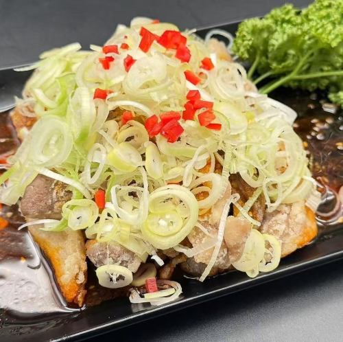 Deep fried pork cutlet with green onions and pickled vegetables