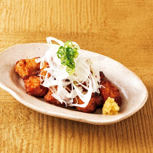 Deep-fried burdock root covered in green onions