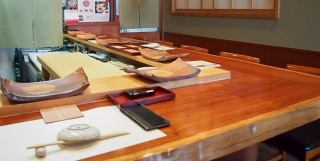 The counter is designed so that you can see the owner making the sushi right in front of you.