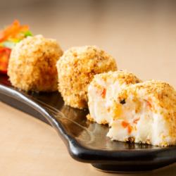 Potato salad with raw croquettes