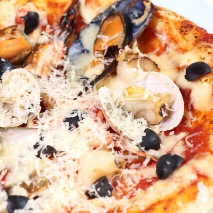 We have a wide selection of pizzas, including Bismarck pizza with soft-boiled egg and prosciutto, and seafood Napoletana.