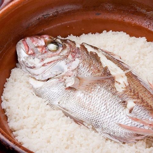 Sea bream rice cooked in an earthenware pot