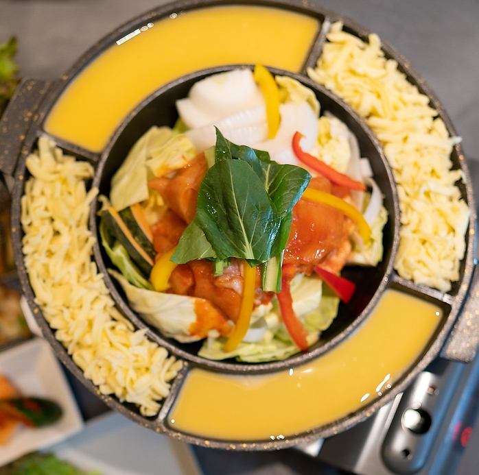 Super popular cheese dakgalbi! Tanatana-style Korean cheese fondue with chicken and vegetables mixed in melty cheese! The stretchy cheese is sure to look great on social media!