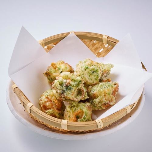 Bite-sized deep-fried fish cakes with cheese inside.