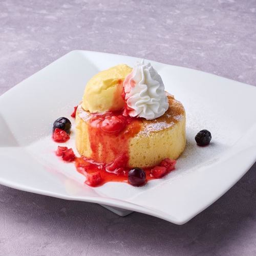 Fluffy pancakes with strawberry sauce