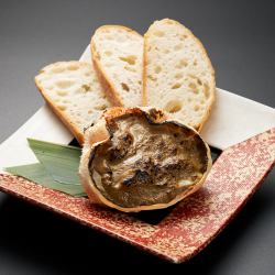 Grilled crab shell with miso sauce, served with baguette
