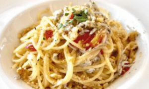 Pasta with whitebait, fresh tomatoes, and walnuts