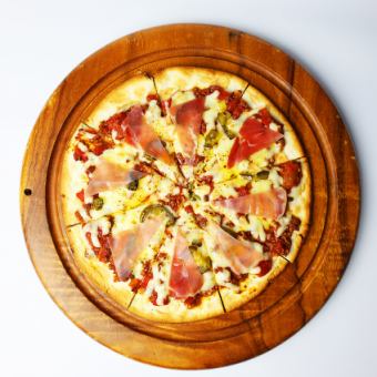 Red hot pizza with jamon serrano and olives